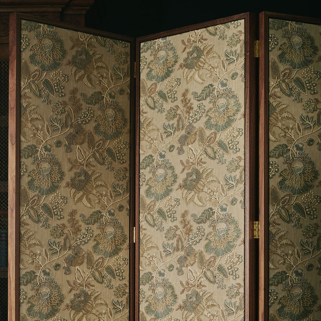 Bespoke walnut room divider screen by Maison Lily Blue, upholstered in Colefax & Fowler fabric with floating panel design.
