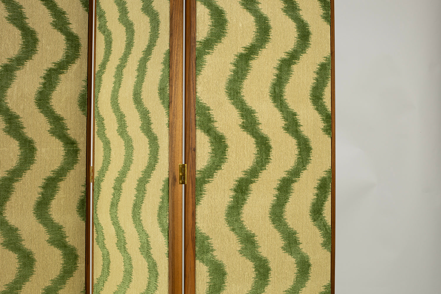 Bespoke walnut room divider screen by Maison Lily Blue, upholstered in Colony by Casa Luiza fabric with signature floating panel design.